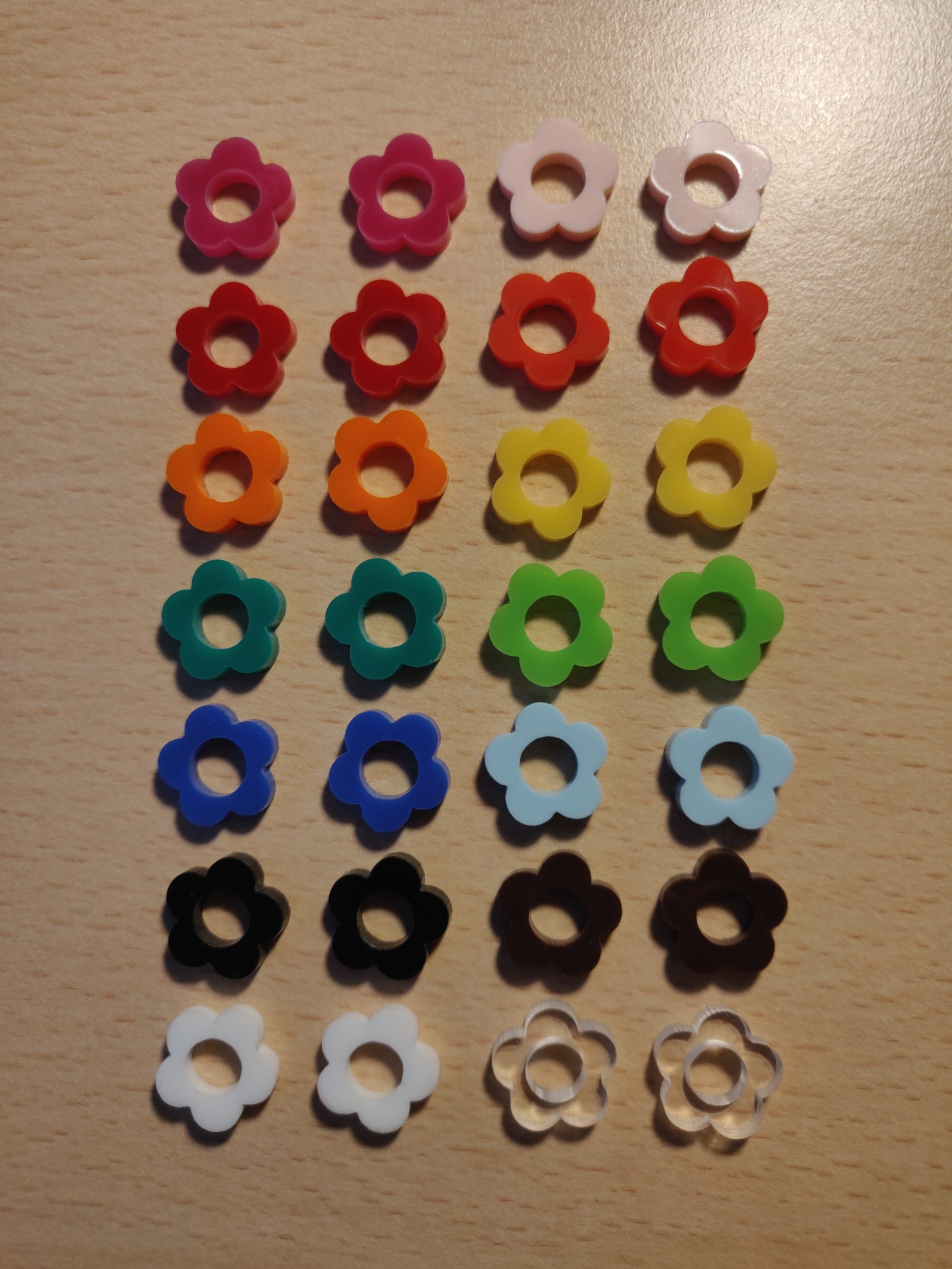 The different colour earrings all laid out